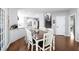Open-concept dining area features hardwood floors and leads to the staircase at 5081 Stone Moss Way, Hoschton, GA 30548