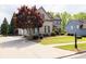 Lovely exterior view of house, highlighting the well-maintained lawn and inviting driveway at 5081 Stone Moss Way, Hoschton, GA 30548
