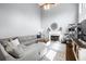 Bright living room features high ceilings, a fireplace, and large windows for natural light at 5081 Stone Moss Way, Hoschton, GA 30548