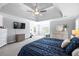Spacious main bedroom with neutral decor, tray ceiling, and plenty of natural light at 5081 Stone Moss Way, Hoschton, GA 30548
