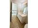 Cozy bathroom with a white vanity and neutral-toned flooring at 771 Franklin Mill Trce, Loganville, GA 30052