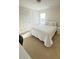 Bedroom featuring a cozy bed, ample natural light, and carpeted floors at 771 Franklin Mill Trce, Loganville, GA 30052