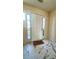 Bright entryway featuring a white door with sidelights and marble-patterned tile flooring at 771 Franklin Mill Trce, Loganville, GA 30052