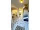 Inviting foyer with marble-style floors, stairs, and an open view to a living area at 771 Franklin Mill Trce, Loganville, GA 30052