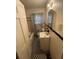 This bathroom features a checkered floor, tub with shower, toilet, and single sink vanity at 1253 Gus Thornhill Jr Dr, Atlanta, GA 30344