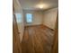 Bedroom with natural light, hardwood floors, and neutral wall color for easy personalization at 1253 Gus Thornhill Jr Dr, Atlanta, GA 30344