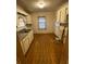 Practical kitchen with white cabinets and updated fixtures at 1253 Gus Thornhill Jr Dr, Atlanta, GA 30344