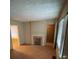 Living room with a fireplace and natural light streaming through the windows at 1253 Gus Thornhill Jr Dr, Atlanta, GA 30344