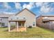 Backyard featuring green grass and a covered patio at 1332 Worcester Trl, Mcdonough, GA 30253