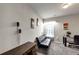 Cozy bedroom/office space with a futon, desk, and ample natural light at 1332 Worcester Trl, Mcdonough, GA 30253
