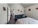 Cozy bedroom featuring carpet, a sofa, and light colored walls at 1332 Worcester Trl, Mcdonough, GA 30253