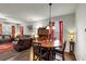 Inviting living room and dining area with hardwood floors and ample natural light at 1332 Worcester Trl, Mcdonough, GA 30253