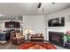 Bright living room with a fireplace and an open view of the kitchen at 1332 Worcester Trl, Mcdonough, GA 30253