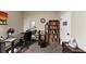 Functional office space with a desk, shelving, and plenty of room for productivity at 1332 Worcester Trl, Mcdonough, GA 30253