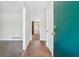 Entryway featuring neutral walls and trim, and tile flooring leading to the living area with brick fireplace at 1360 Cypress Ridge Cir, Stone Mountain, GA 30083