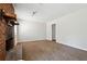 Spacious living room featuring carpet floors and a brick fireplace at 1360 Cypress Ridge Cir, Stone Mountain, GA 30083