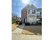 Charming two-story townhome with brick and siding, featuring a well-manicured lawn and inviting entryway at 2742 Snapfinger Manor, Decatur, GA 30035