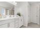 Bright bathroom features double sinks, modern vanity, and a glass-enclosed shower, creating a sleek design at 9893 Colchester St, Douglasville, GA 30135