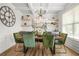 Elegant dining room featuring modern lighting, stylish decor, and ample seating at 9893 Colchester St, Douglasville, GA 30135
