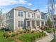 Beautifully landscaped two-story home with a welcoming front porch and a well-manicured lawn at 9893 Colchester St, Douglasville, GA 30135