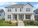 Charming two-story home with a covered front porch, perfect for enjoying the outdoors at 9893 Colchester St, Douglasville, GA 30135