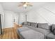 Upstairs living room with comfortable sofa, soft lighting and hardwood floors throughout at 9893 Colchester St, Douglasville, GA 30135