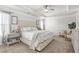 Relax in this spacious main bedroom with tray ceilings, ceiling fan, and soothing decor creating a tranquil space at 9893 Colchester St, Douglasville, GA 30135