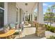 Inviting front porch with stone pillars, a porch swing, and stylish seating at 9893 Colchester St, Douglasville, GA 30135