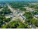Wide aerial view of neighborhood, showcasing lush greenery and commercial areas at 175 Moreland Se Ave, Atlanta, GA 30316
