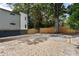 Large backyard with gravel groundcover, privacy fence, and mature trees providing shade at 175 Moreland Se Ave, Atlanta, GA 30316