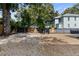View of the backyard featuring a gravel area, wooden fence, and lush greenery providing privacy at 175 Moreland Se Ave, Atlanta, GA 30316