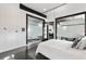 Modern bedroom featuring frosted glass walls, dark trim, and plenty of natural light at 175 Moreland Se Ave, Atlanta, GA 30316