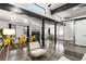 Open concept living space with modern furniture, dining area, and exposed beams at 175 Moreland Se Ave, Atlanta, GA 30316