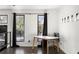 Bright office space featuring dark wood floors, black framed windows, and a modern white and wood desk at 175 Moreland Se Ave, Atlanta, GA 30316