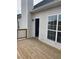 Wooden deck adjacent to large window at 203 Sea Marsh Ct, Fayetteville, GA 30215