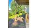 Backyard featuring a tranquil lake view, lush greenery, and sturdy deck support, creating a peaceful outdoor oasis at 203 Sea Marsh Ct, Fayetteville, GA 30215