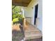 Exterior view of a well-maintained deck area and lush backyard, perfect for outdoor relaxation and entertaining at 203 Sea Marsh Ct, Fayetteville, GA 30215