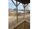 Backyard featuring a picturesque lake view framed by mature trees, creating a serene and private oasis at 203 Sea Marsh Ct, Fayetteville, GA 30215