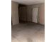 Spacious unfinished basement with concrete flooring and a door for easy access at 203 Sea Marsh Ct, Fayetteville, GA 30215
