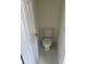 A small bathroom with a toilet at 203 Sea Marsh Ct, Fayetteville, GA 30215