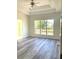 Bedroom with new flooring and windows looking out onto the well manicured lawn at 203 Sea Marsh Ct, Fayetteville, GA 30215