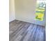 Laminate floor and large window in a bright bedroom at 203 Sea Marsh Ct, Fayetteville, GA 30215