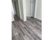 Light-filled bedroom boasting sleek modern flooring, neutral walls, and ample closet space at 203 Sea Marsh Ct, Fayetteville, GA 30215