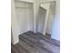 Walk-in closet with new flooring, plenty of storage space and a full-length mirror at 203 Sea Marsh Ct, Fayetteville, GA 30215