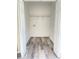 Empty closet featuring hardwood flooring, wire shelving, and neutral paint, offering versatile storage options at 203 Sea Marsh Ct, Fayetteville, GA 30215