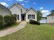 Charming single-story home with front yard overlooking a serene lake at 203 Sea Marsh Ct, Fayetteville, GA 30215