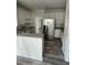 Modern kitchen with stainless steel appliances, granite countertop, and island at 203 Sea Marsh Ct, Fayetteville, GA 30215