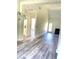 Charming living room with hardwood floors, fireplace, and natural light at 203 Sea Marsh Ct, Fayetteville, GA 30215