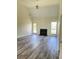 Inviting living room features a fireplace, hardwood floors, and a bright open space at 203 Sea Marsh Ct, Fayetteville, GA 30215