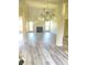 Spacious living room featuring high ceilings, hardwood floors, and a cozy fireplace at 203 Sea Marsh Ct, Fayetteville, GA 30215